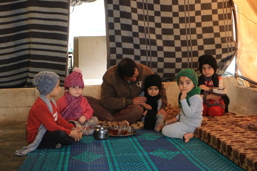 man met gezin syrie